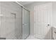 Modern shower stall showcasing marble walls, a glass door, and elegant fixtures at 2544 Overlook Dr, Atlanta, GA 30344