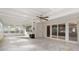 Sun room featuring a ceiling fan, tiled floor, and decorative fireplace at 2544 Overlook Dr, Atlanta, GA 30344