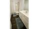Neutral bathroom featuring dark wood floors, a standard bathtub shower, and a white sink with vanity at 1338 Barrett Bluff Dr, Lawrenceville, GA 30045