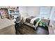 Charming bedroom featuring wood floors, natural light, and a comfortable place to relax and study at 1338 Barrett Bluff Dr, Lawrenceville, GA 30045