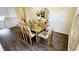 Bright dining room with an open layout, hardwood floors, and direct access to the kitchen at 1338 Barrett Bluff Dr, Lawrenceville, GA 30045