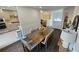Bright dining room with an open layout, hardwood floors, and direct access to the kitchen at 1338 Barrett Bluff Dr, Lawrenceville, GA 30045