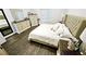 Spacious bedroom with a neutral palette, hardwood floors, and natural light creating a relaxing atmosphere at 1338 Barrett Bluff Dr, Lawrenceville, GA 30045