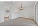 Bright dining area next to the kitchen, featuring neutral tones and a stylish chandelier at 2209 N Forest Trl, Atlanta, GA 30338