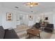 Bright living room featuring neutral tones, a ceiling fan, and ample space for relaxation and entertaining at 2209 N Forest Trl, Atlanta, GA 30338