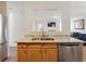 Open concept kitchen features stainless steel appliances, granite counters, and ample cabinet space at 2304 Stancrest Ln, Lawrenceville, GA 30044
