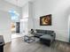 Bright living room featuring a sofa, hardwood floors, and high ceilings at 2304 Stancrest Ln, Lawrenceville, GA 30044