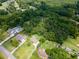 A lush, wooded property featuring nearby houses with a community pool at 4017 S South Bogan Road Rd, Buford, GA 30519
