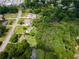 Aerial view showcases the property with beautiful green landscaping near other homes at 4017 S South Bogan Road Rd, Buford, GA 30519