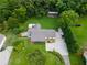 Aerial view of the home showcasing lush lawn, mature trees and driveway at 4017 S South Bogan Road Rd, Buford, GA 30519