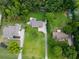 An aerial view of a large property featuring mature trees and a well maintained lawn at 4017 S South Bogan Road Rd, Buford, GA 30519