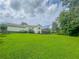 Lush backyard featuring green grass and a deck, perfect for outdoor enjoyment at 4017 S South Bogan Road Rd, Buford, GA 30519