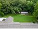 A large backyard with a detached garage and ample tree coverage at 4017 S South Bogan Road Rd, Buford, GA 30519