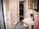 Cozy bathroom with a pedestal sink and seashell patterned shower curtain at 4017 S South Bogan Road Rd, Buford, GA 30519