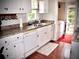 Bright kitchen featuring white cabinets, updated counters, and modern appliances at 4017 S South Bogan Road Rd, Buford, GA 30519