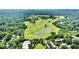 Aerial view of community near a lush green golf course at 211 Colonial Homes Nw Dr # 1102, Atlanta, GA 30309