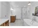 Modern bathroom featuring a freestanding tub, glass shower, and double vanity at 211 Colonial Homes Nw Dr # 1102, Atlanta, GA 30309