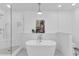 Modern bathroom with a freestanding tub, glass shower, and elegant decor at 211 Colonial Homes Nw Dr # 1102, Atlanta, GA 30309