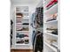 Walk-in closet with built-in shelving and organized storage for clothes and accessories at 211 Colonial Homes Nw Dr # 1102, Atlanta, GA 30309