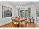 Bright dining area featuring a wooden table, chandelier, and large windows at 211 Colonial Homes Nw Dr # 1102, Atlanta, GA 30309