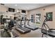 Bright gym space featuring modern treadmills and fitness equipment with large mirrors and exterior views at 211 Colonial Homes Nw Dr # 1102, Atlanta, GA 30309