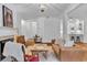 Stylish living room with hardwood floors, fireplace, and views into kitchen, perfect for modern living and entertaining at 211 Colonial Homes Nw Dr # 1102, Atlanta, GA 30309