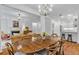 Open-concept living room with dining area, fireplace, and kitchen with bar stool seating at 211 Colonial Homes Nw Dr # 1102, Atlanta, GA 30309