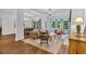 Bright living room with hardwood floors, large windows, and elegant furnishings, creating a warm and inviting atmosphere at 211 Colonial Homes Nw Dr # 1102, Atlanta, GA 30309