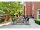 Inviting patio with a stylish seating area, complete with comfortable furniture, decorative rug, and charming accents at 211 Colonial Homes Nw Dr # 1102, Atlanta, GA 30309