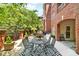 Relaxing outdoor patio features a dining table and chairs, creating a cozy space for outdoor dining and entertaining at 211 Colonial Homes Nw Dr # 1102, Atlanta, GA 30309