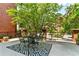 Relaxing rooftop patio with comfortable seating and lush landscaping at 211 Colonial Homes Nw Dr # 1102, Atlanta, GA 30309