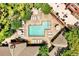 Overhead view of a pool with ample deck space, lounge chairs, and lush landscaping for a relaxing outdoor retreat at 211 Colonial Homes Nw Dr # 1102, Atlanta, GA 30309