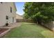 Home's backyard featuring lawn and fenced in border at 2983 Albright Nw Commons, Kennesaw, GA 30144