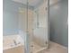 Modern bathroom featuring glass-enclosed shower and luxurious soaking tub at 2983 Albright Nw Commons, Kennesaw, GA 30144