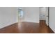 Primary bedroom with hardwood floors leads to an ensuite bathroom with a soaking tub at 2983 Albright Nw Commons, Kennesaw, GA 30144