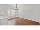 Bright dining area featuring hardwood floors and a large window offering plenty of natural light at 2983 Albright Nw Commons, Kennesaw, GA 30144