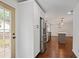 Modern kitchen with stainless steel refrigerator and access to the fenced-in backyard at 2983 Albright Nw Commons, Kennesaw, GA 30144