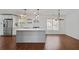 Modern kitchen with stainless steel appliances, white cabinetry, and a large center island at 2983 Albright Nw Commons, Kennesaw, GA 30144