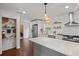 Well-equipped kitchen with stainless steel appliances, white cabinets, open shelving, and a large island at 2983 Albright Nw Commons, Kennesaw, GA 30144