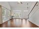 Bright living room featuring hardwood floors, high ceilings, large windows and a staircase at 2983 Albright Nw Commons, Kennesaw, GA 30144