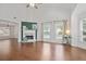Bright living room featuring a fireplace, hardwood floors, high ceilings, and large windows at 2983 Albright Nw Commons, Kennesaw, GA 30144