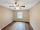 Bedroom with hardwood floors and a view of the outdoors at 2992 Parc Lorraine, Lithonia, GA 30038