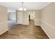 Spacious dining room with hardwood floors, white trim, and light fixture at 2992 Parc Lorraine, Lithonia, GA 30038