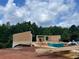 New home under construction with wood framing and beautiful treed backdrop at 3063 Reserve Ct Sw, Conyers, GA 30094