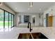 Gourmet kitchen with expansive island, quartz countertops, and open concept layout at 3063 Reserve Ct Sw, Conyers, GA 30094