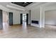 Spacious main bedroom boasts hardwood floors, modern fireplace, tray ceiling, and access to the luxurious main bath at 3063 Reserve Ct Sw, Conyers, GA 30094