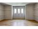 Spacious walk-in closet with hardwood floors and three windows at 3063 Reserve Ct Sw, Conyers, GA 30094