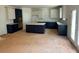 Spacious kitchen with white and dark blue cabinets, granite countertops, and stainless steel appliances at 3294 Mill Forest Dr, Conyers, GA 30094