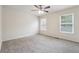 Large bedroom with soft carpet, ceiling fan, natural light, and versatile layout for relaxation at 4282 Worth Nw St, Acworth, GA 30101