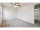 A bright bedroom features neutral walls and carpet, along with a ceiling fan for comfort at 4282 Worth Nw St, Acworth, GA 30101